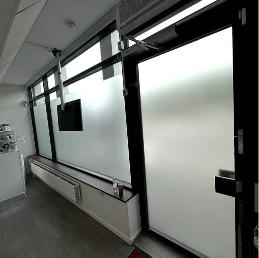 Frosted privacy film fitted across office windows and an entrance door