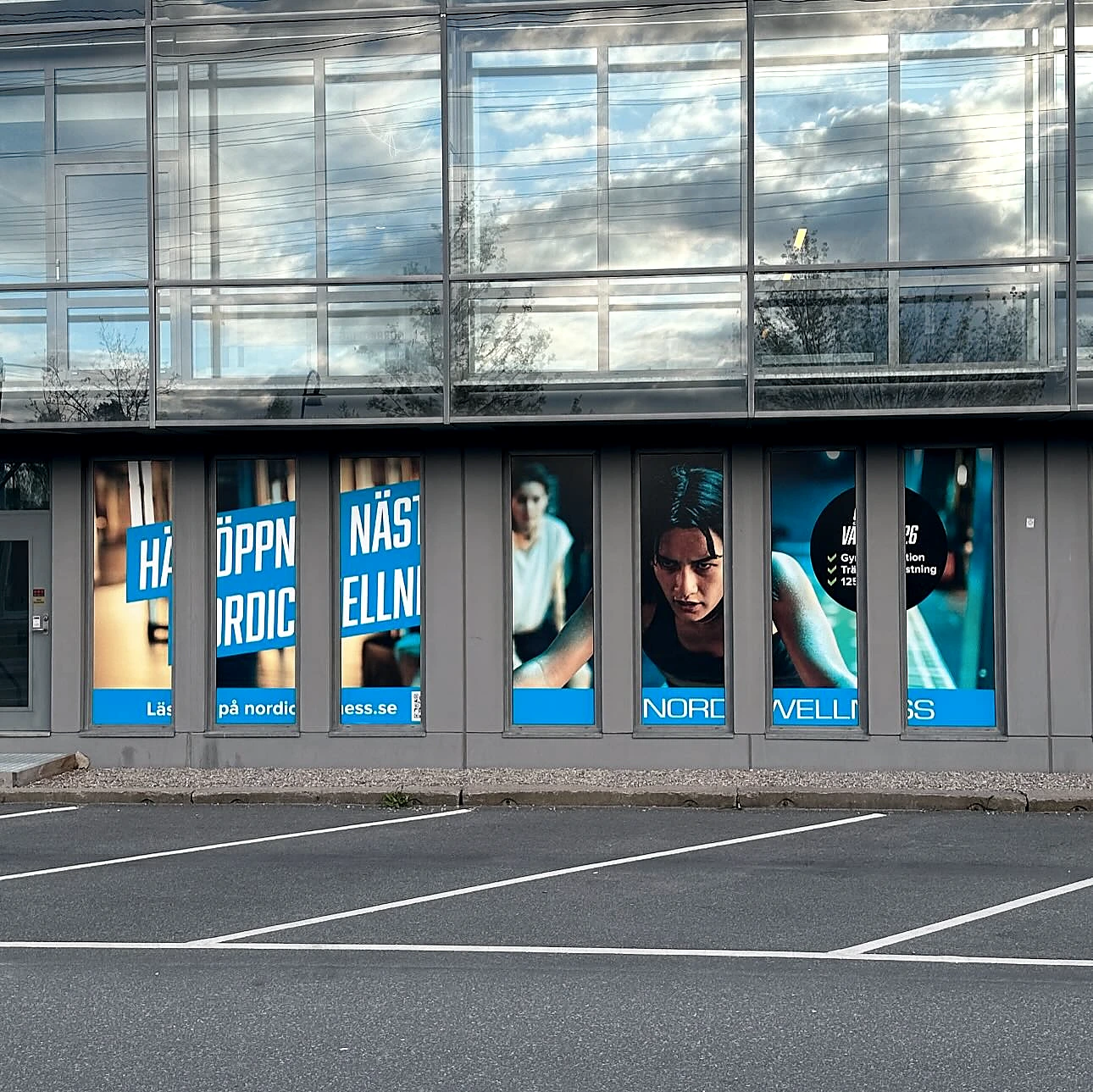 Closer view of high-impact window graphics on commercial building
